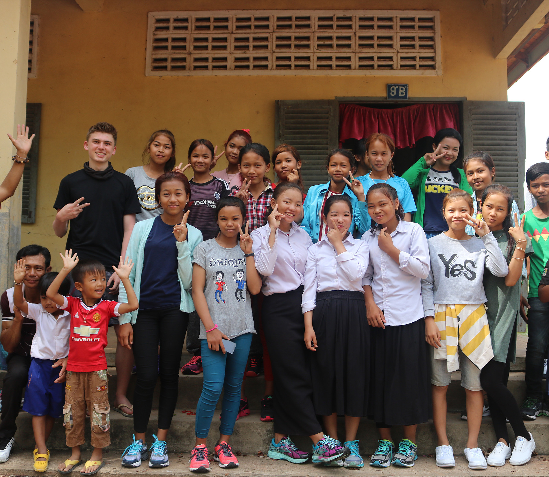 Cambodia students posing with new shoes